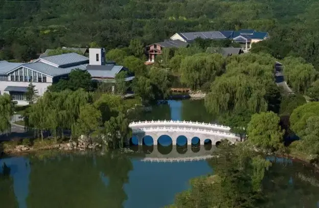 Airiel view of bridge over waterway leading to hotel